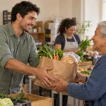 Volunteers pass a bag of fresh groceries to a neighbor at a community food pantry.